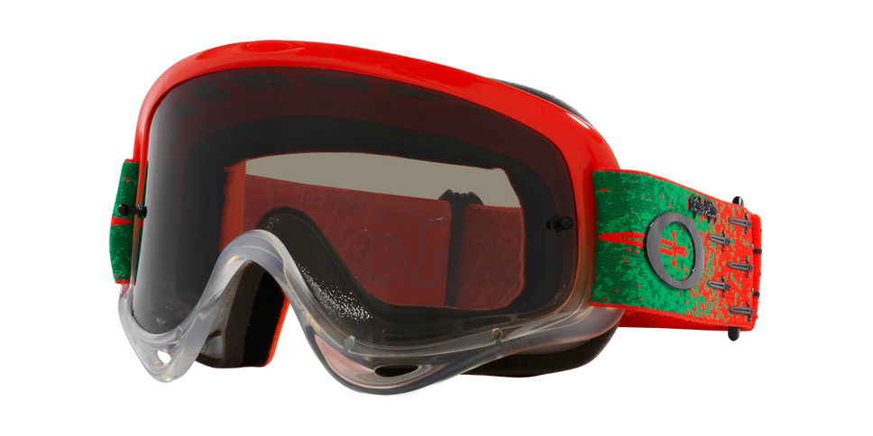 O-Frame MX Troy Lee Designs Series goggles by Oakley with tinted lenses and adjustable straps for motocross riding.