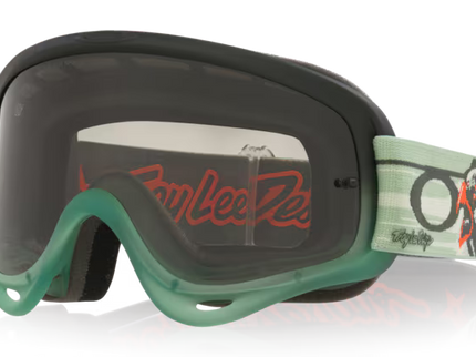 Oakley O-FRAME MX Tribe W/Clear MX goggles with clear lens and adjustable strap for off-road motocross riding.