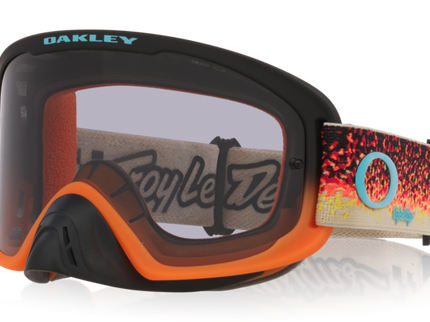 Oakley O-Frame PRO MX goggles in black and orange with light gray lenses, designed for motocross riding.