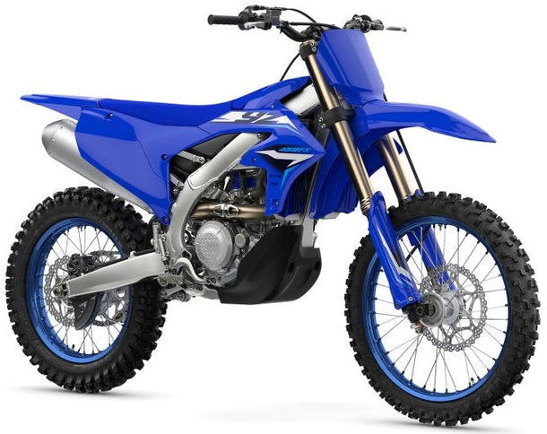 Yamaha YZ450FX dirt bike with blue and black body panels, front suspension, knobby tires, and racing graphics.