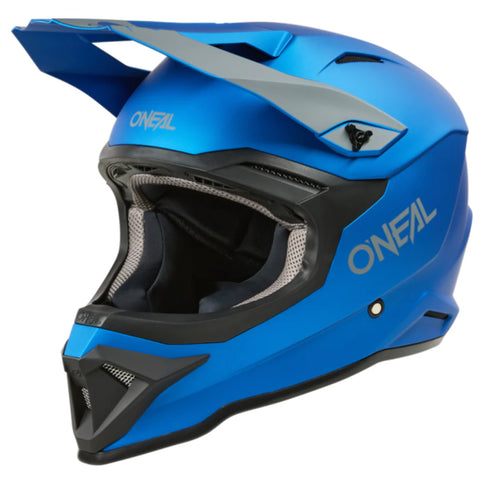 O'NEAL MX helmet in blue and black with a sleek design, featuring ventilation vents and adjustable straps.