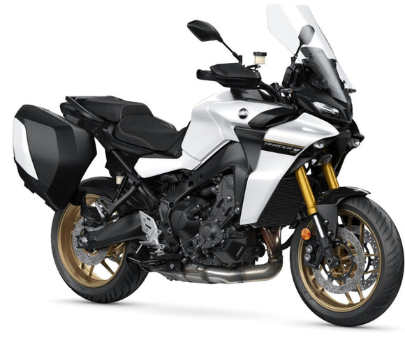 Yamaha Tracer 900 GT sports touring motorcycle in pure white, viewed from the front side in studio setting.