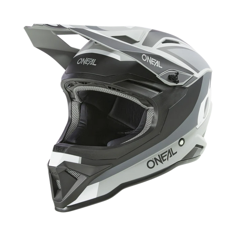 O'NEAL 1 SRS grey MX helmet with black and gray design, front and left view, featuring ventilation and aerodynamic shape.