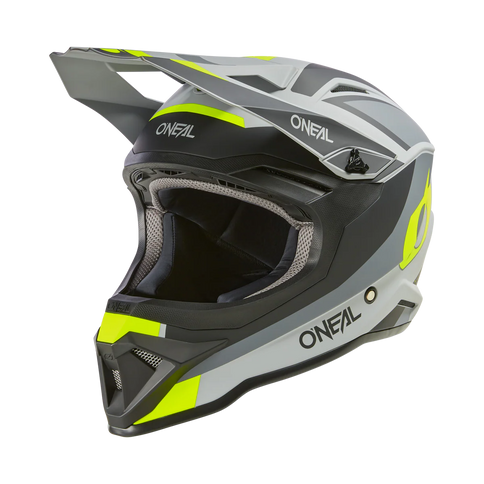 O'NEAL 1 SRS grey and yellow MX helmet with black neon accents, front-left view, featuring aerodynamic design for motocross racing.