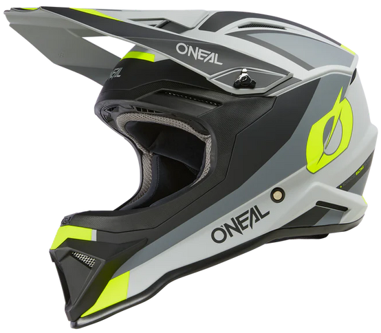 O'NEAL 1 SRS grey and yellow motocross helmet with black accents, featuring a streamlined design and adjustable chin strap.