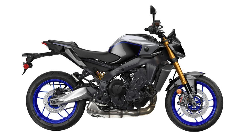 Yamaha MT-09 SP motorcycle in blue with sporty design, featuring aggressive styling and sleek bodywork.