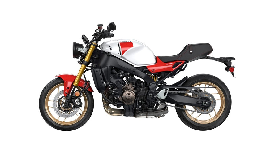 Yamaha XSR 900 motorcycle shown from a side angle, featuring a sleek black body and modern design elements.