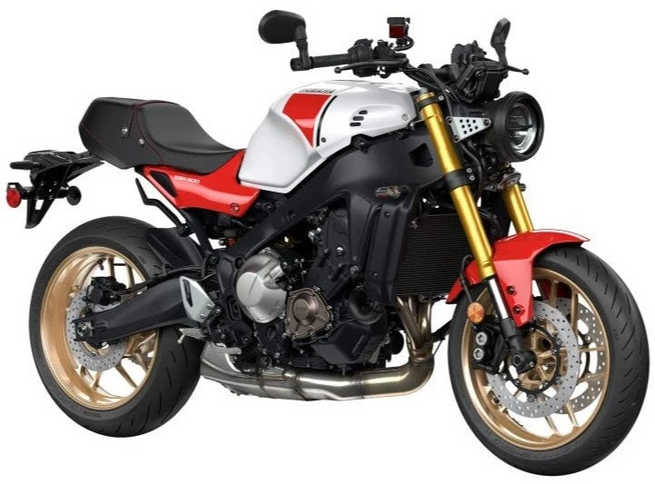 Yamaha XSR 900 motorcycle with sleek black body, sporty design, and modern headlights, parked on a city street.