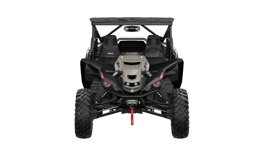 Yamaha YXZ1000R side-by-side off-road vehicle with rugged front design and bold branding, ready for outdoor adventure.