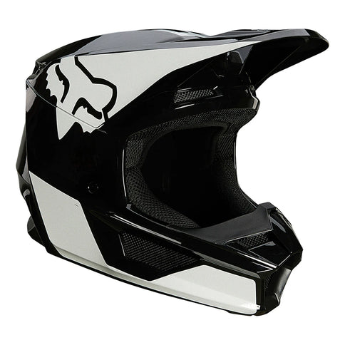 Black and white FOX V1 Revn youth motocross helmet with vents and adjustable strap, designed for young riders.