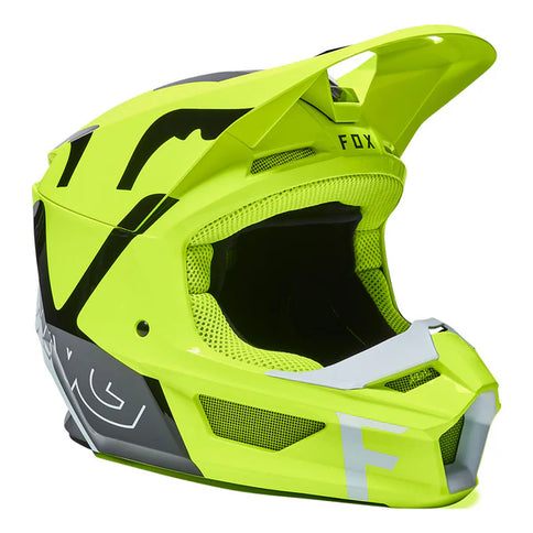 FOX V1 SKEW Youth MX helmet in vibrant yellow with black graphics, designed for motocross riding protection and style.
