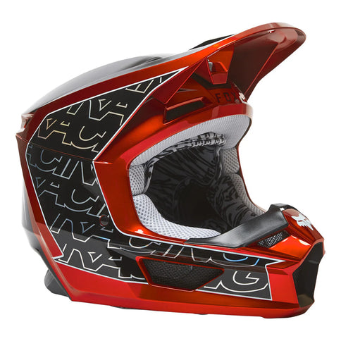 Red V1 PERIL Youth MX helmet by FOX with ventilation vents and adjustable straps, designed for motocross riding.