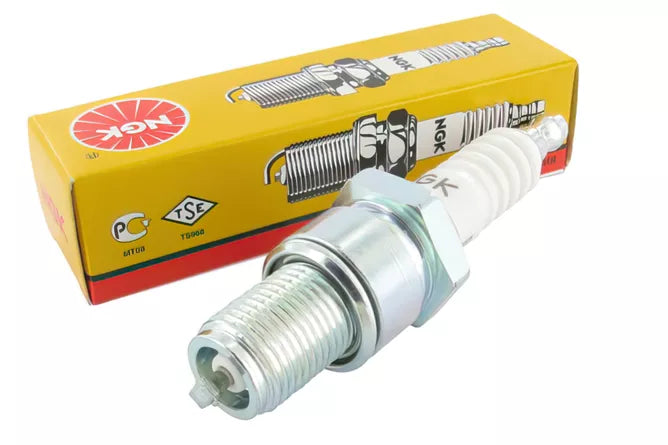 NGK BR8ES spark plug with metal and ceramic insulator, showing the threaded metal shell and electrode tips.