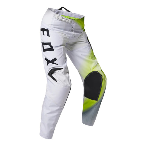 FOX 180 Toxsyk Youth MX Pants in Flo Yellow with reinforced knee areas and adjustable waistband for motocross riding.