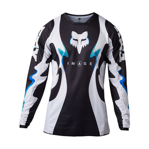 Black and white FOX Kozmik MX jersey featuring bold graphics and comfortable fit, designed for motocross riders.