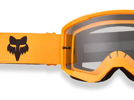FOX MAIN CORE MX Goggle in tangerine with clear lens and adjustable strap, designed for motocross riding.