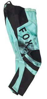 Fox 180 KAIROS Youth MX Pants in turquoise, showcasing durable motocross pants with reinforced knees and adjustable waist.