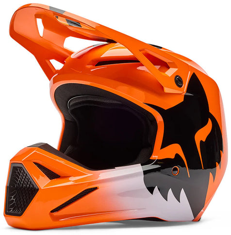 FOX V1 Shield helmet in flo orange with a sleek motocross design, featuring protective padding and ventilation for riders.