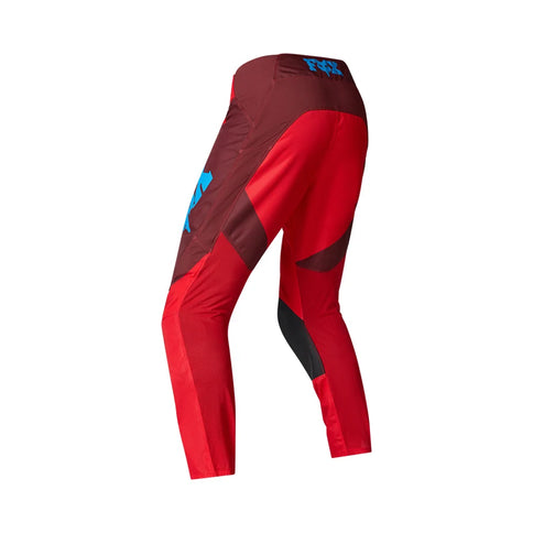 Fox 180 RAID MX pants in black, featuring reinforced knee areas and adjustable waist for motocross riding comfort.