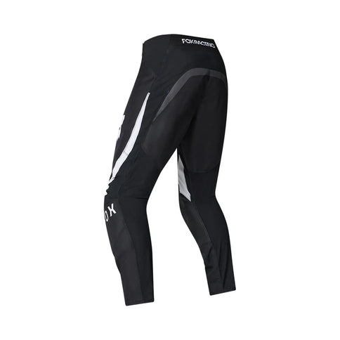 Black MX pants from FOX with a 180 frame design, featuring durable fabric and adjustable waist for motocross riding.