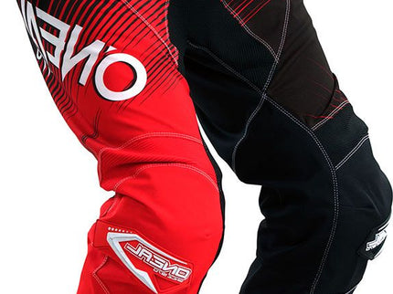 Black and red ONEAL MX racewear motocross pants with reinforced knee panels and adjustable waist for a secure fit.