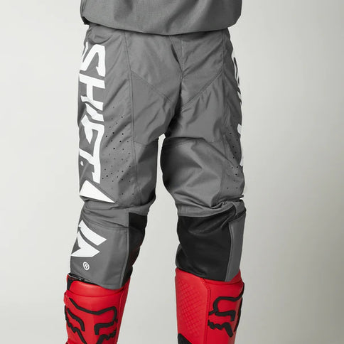 Grey and white SHIFT WHIT3 Label Trac MX Pants with adjustable waistband and logo detailing, designed for motocross riding.