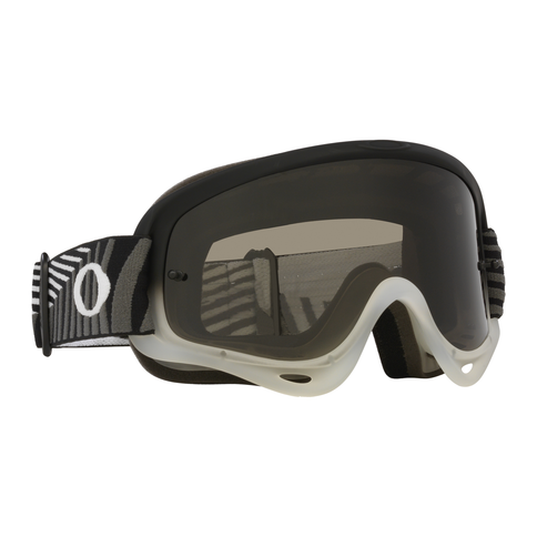 Oakley O-Frame MX Goggle in black with brutal dark grey frame, featuring clear lens and adjustable strap for motocross riding.