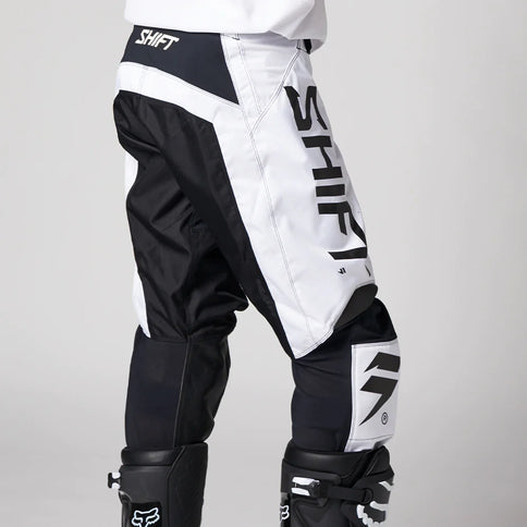 Shift WHIT3 Label Trac MX Pants in white and black with reinforced knee panels and adjustable waist for motocross riding.