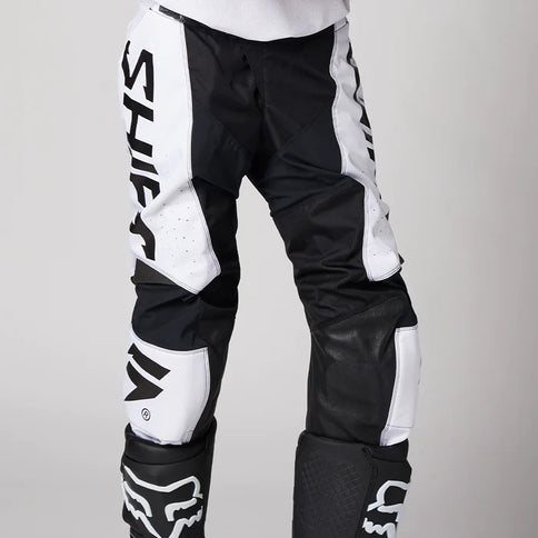 SHIFT WHIT3 Label Trac MX Pants in white and black with sleek design and adjustable waistband, suitable for motocross riding.