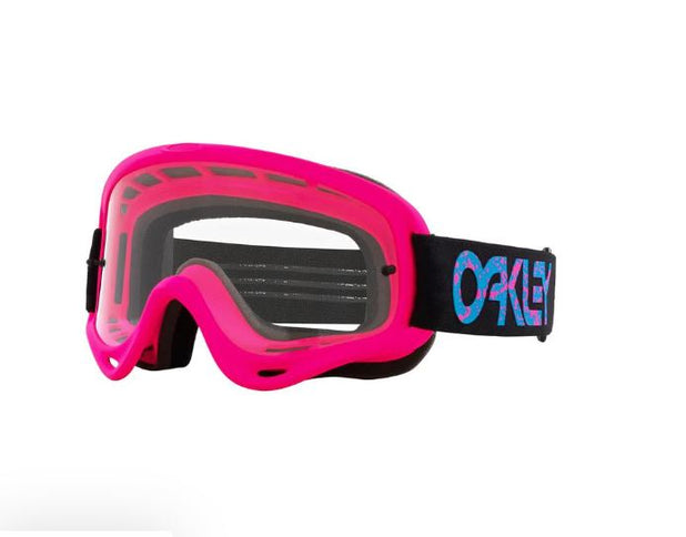 Oakley O-Frame MX Goggle with clear lens and pink splatter design, ideal for motocross riding.