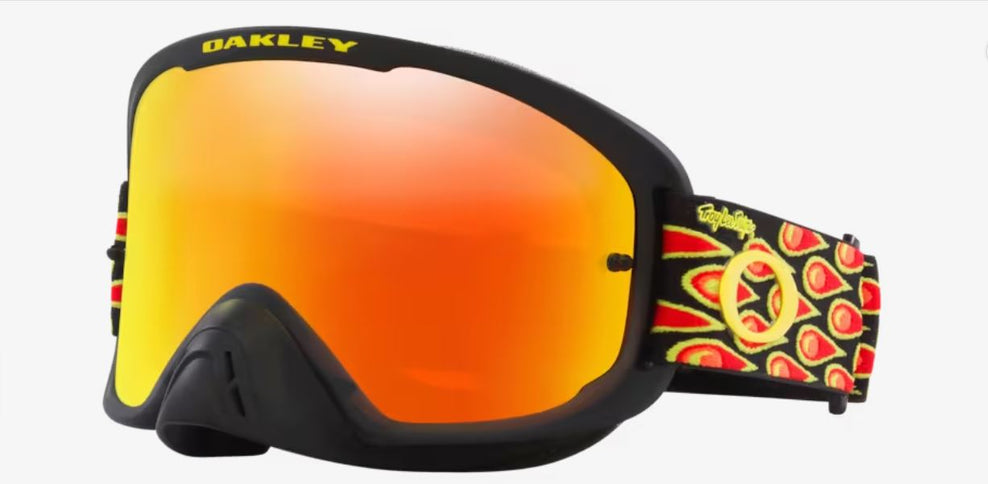 Oakley O-Frame Pro 2.0 MX goggles with black bubbles design and fire accents, featuring durable frame and clear lenses for motocross riding.