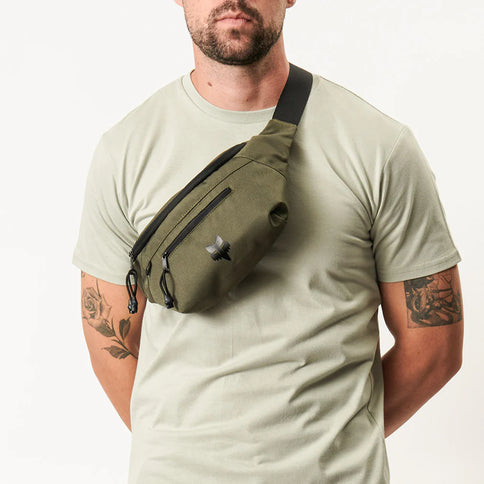 Fox Main Hip Pack in Fatigue color, featuring adjustable straps and compact design for secure carrying during outdoor activities.