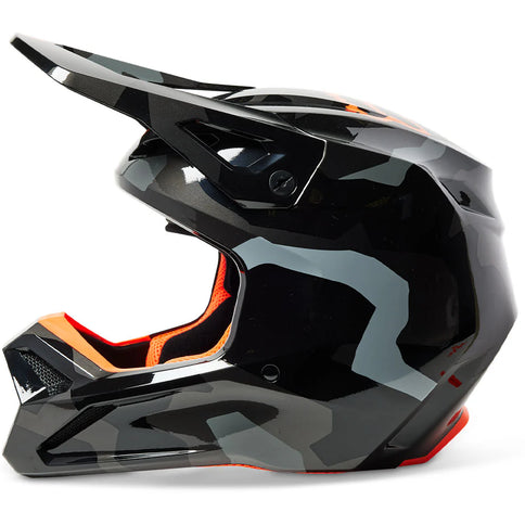 Fox MX V1 BNKR YTH helmet in gray camouflage, youth MX helmet with durable shell and adjustable strap for motocross riding.