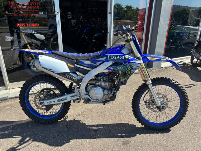 Used 2021 Yamaha YZ 450 F dirt bike with black and blue bodywork and off-road tires, showcasing the Yamaha motocross motorcycle.