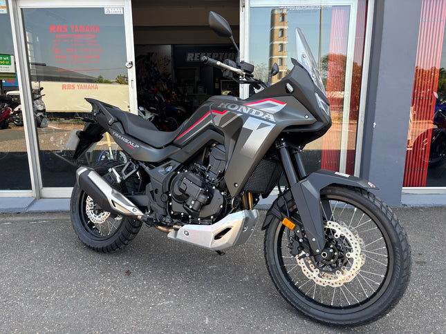 Used Honda 2026 Transalp 750 E clutch demo bike, showing the motorcycle's front view and detailed clutch area.