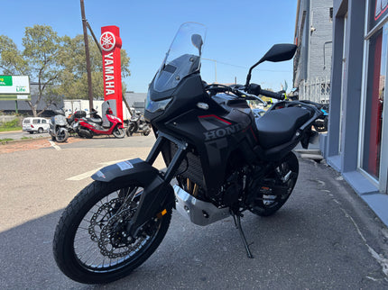 Used Honda 2026 Transalp 750 E clutch demo motorcycle, showing the bike's front view and detailed clutch area.