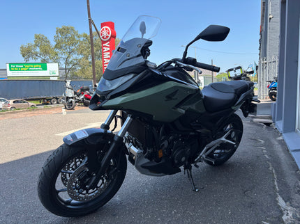 Used 2026 Honda NC 750X demo motorcycle, black and silver, showing the seat, handlebars, and front view.