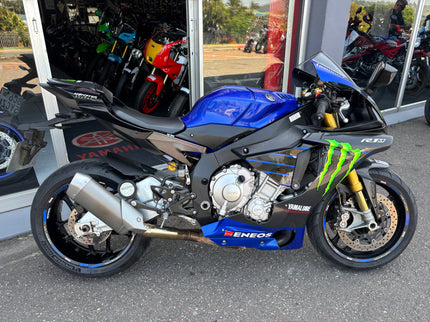 Used 2015 Yamaha YZF R1 M motorcycle in blue with racing decals and aerodynamic fairings.