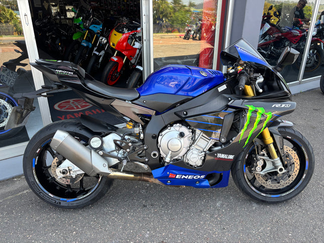 Used 2015 Yamaha YZF R1 M motorcycle in blue with racing decals and aerodynamic fairings.