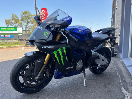 Used 2015 Yamaha YZF R1 M motorcycle, black and white sport bike with sleek design, front view, in good condition.