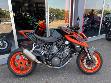 Used Yamaha motorcycle, 2019 KTM 1290 Superduke model, with sporty design and black and orange color scheme.