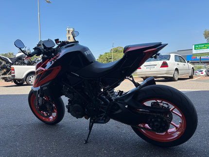 Used Yamaha motorcycle, 2019 KTM 1290 Superduke model, with black and orange bodywork and sporty design.