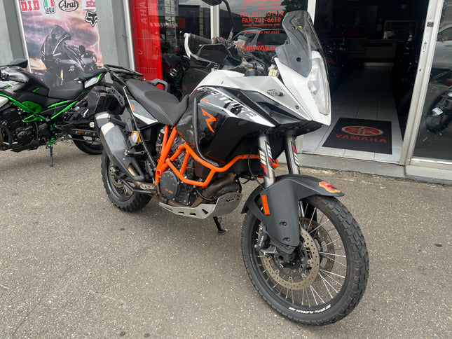 Used 2013 KTM 1190 Adventure R motorcycle, black and orange touring bike with rugged off-road tires and KTM branding.