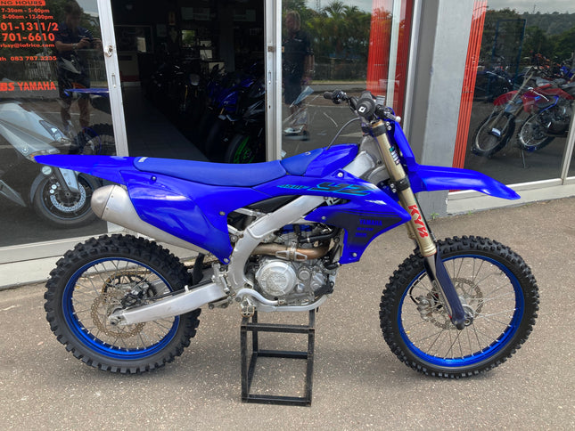 Used 2024 Yamaha YZ 450 F dirt bike, black and yellow motorcycle with knobby tires and Yamaha logo on the side.
