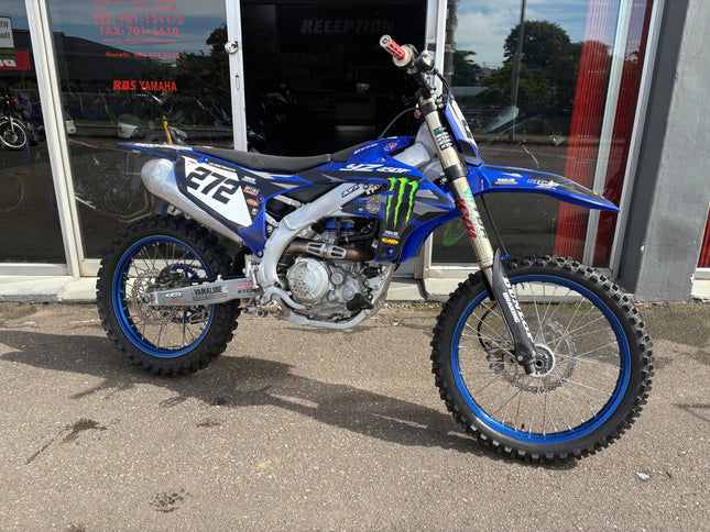 Used 2024 Yamaha YZ 450 F dirt bike with rugged tires, sleek blue body, and Yamaha branding, ready for off-road riding.