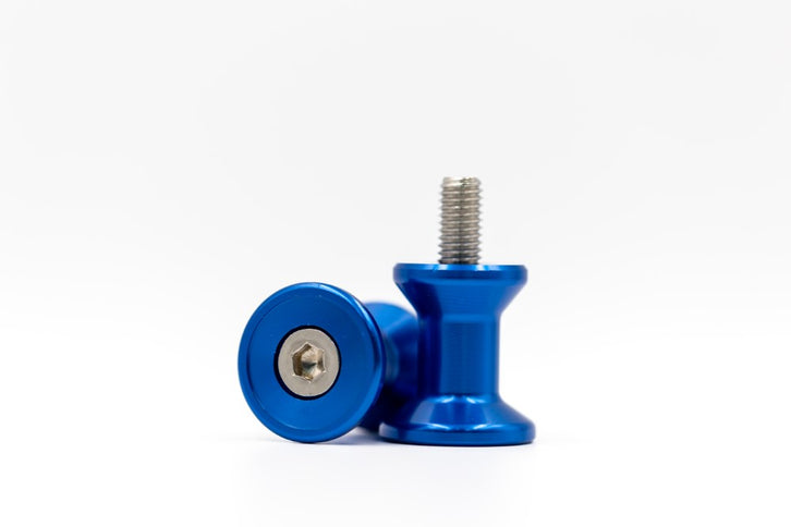 Blue 10mm stand bobbins from RNG, showing a close-up of the small plastic spools used for sewing or crafting projects.