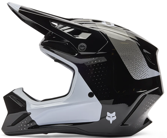 Black FOX V3 Tine motocross helmet with ventilation vents and adjustable visor, designed for off-road riding.