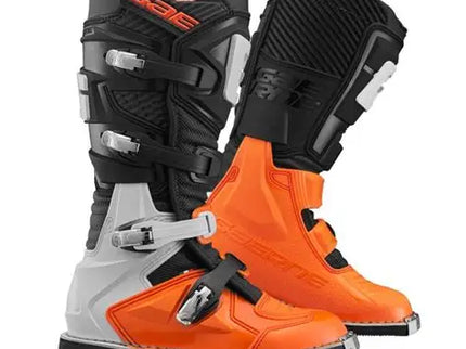 Black and orange GXJ Junior MX boots by GAERNE with sturdy construction and adjustable straps for young motocross riders.