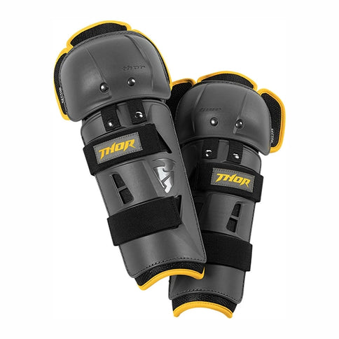 Grey and yellow Thor Sector Youth knee guard showing padded knee protection with adjustable straps for secure fit.