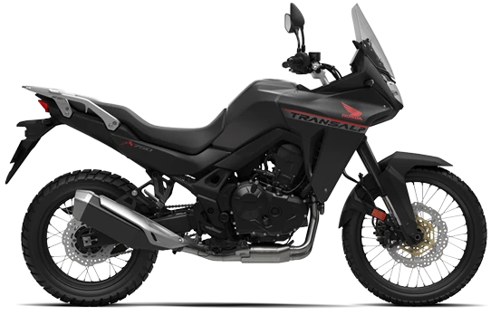 Honda TransAlp motorcycle with ballistic black metallic finish, showcasing the sleek and rugged design of the bike.